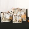 white cardboard gift bags