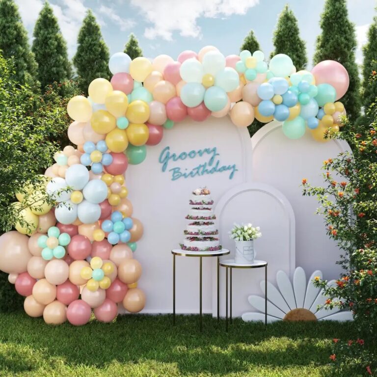 It's a beautiful outdoor birthday scene decoration with a colorful balloon arch